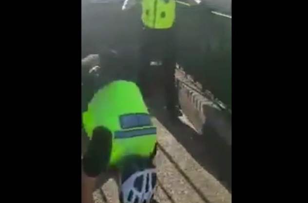 policeman falls off bike