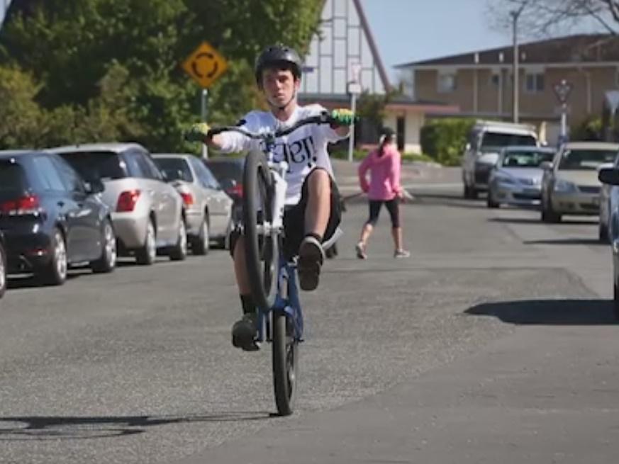 teenage cyclist wheelie