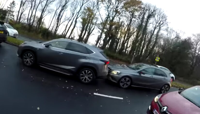 Driver crashes into car after arguing with cyclist over road safety (video)