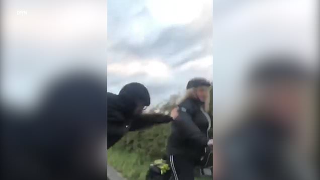 Car passenger caught on camera pushing female cyclist into a bush